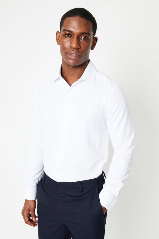 Slim fit shirt tailored for a sharp silhouette
cavalry twill fabric for a smart look
Easy iron finish for effortless maintenance
Spread collar for a refined appearance
Long sleeves with buttoned cuffs

Exuding sophistication, this slim fit shirt from Burton is a versatile choice for smart casual occasions. The cavalry twill fabric and easy iron finish ensure a polished look with minimal upkeep. Pair it with chinos or tailored trousers for a refined yet relaxed ensemble, perfect for after-work drinks or weekend brunches with friends. The spread collar and buttoned cuffs add a touch of elegance, making it an ideal option for more formal events as well.