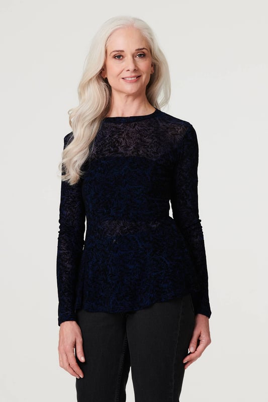 Stand out from the crowd in this delicate lace print peplum mesh top. With a high round neck, long sleeves, a high low hem and a sheer mesh fabric. Style with a cami top, high waist trousers and heels for an elegant evening look or be daring by layering over a bralette and high rise faux leather trousers and heels for cocktail hour.