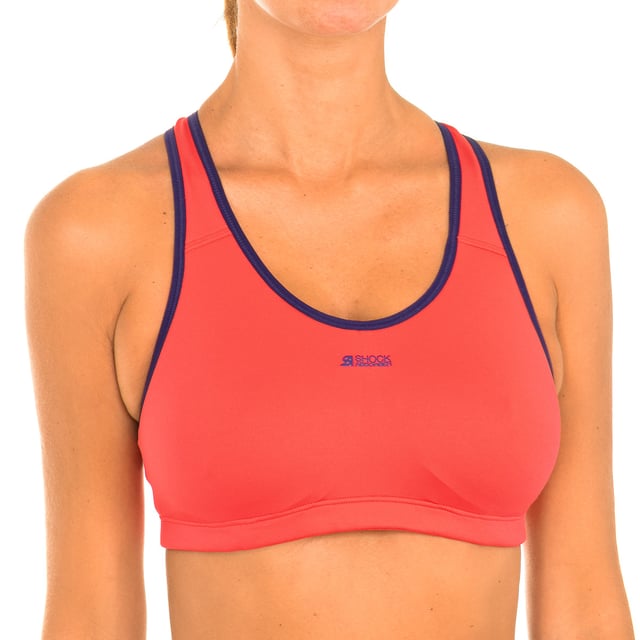 Sujetador deportivo.
Color Coral-rosa
Concebido para mujeres practicantes de todo tipo de deporte.
 Sujetador de diseño moderno con banda elástica bajo el pecho.
Sistema único de Niveles de sujeción.
 Firma de la marca estampado en el frontal superior.
Costuras vistas a tono.

Composición:
50% Poliamida - 44% Poliester - 6% Elastano

Cuidados:
Lavar máximo 40º
No planchar
No usar lejía
No centrifugar
