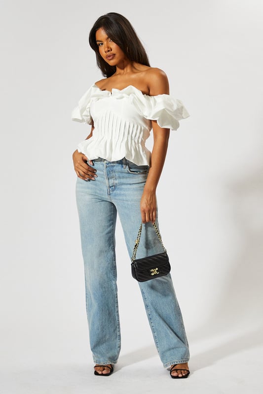 Striking bardot neckline with ruffle detail
        Cinched waist for a flattering silhouette
        Off-shoulder design with short sleeves
        Textured fabric with vertical pleating
        Cropped length perfect for high-waisted bottoms
    
    Make a statement with this eye-catching Ruffle Bardot Cinched Waist Top from MissPap. The off-shoulder design with its dramatic ruffle detail creates a captivating look that's sure to turn heads. The cinched waist accentuates your figure, while the vertical pleating adds texture and interest. Perfect for those who love to be the centre of attention, this top pairs beautifully with high-waisted jeans for a casual yet stylish ensemble. Dress it up with a sleek skirt and heels for a night out, or keep it relaxed with wide-leg trousers and trainers for a chic daytime look. Whether you're heading to a family gathering or meeting friends for drinks, this versatile piece allows you to customise your style to suit any casual occasion. The cropped length is ideal for showing off your favourite bottoms, making it a must-have addition to your wardrobe.