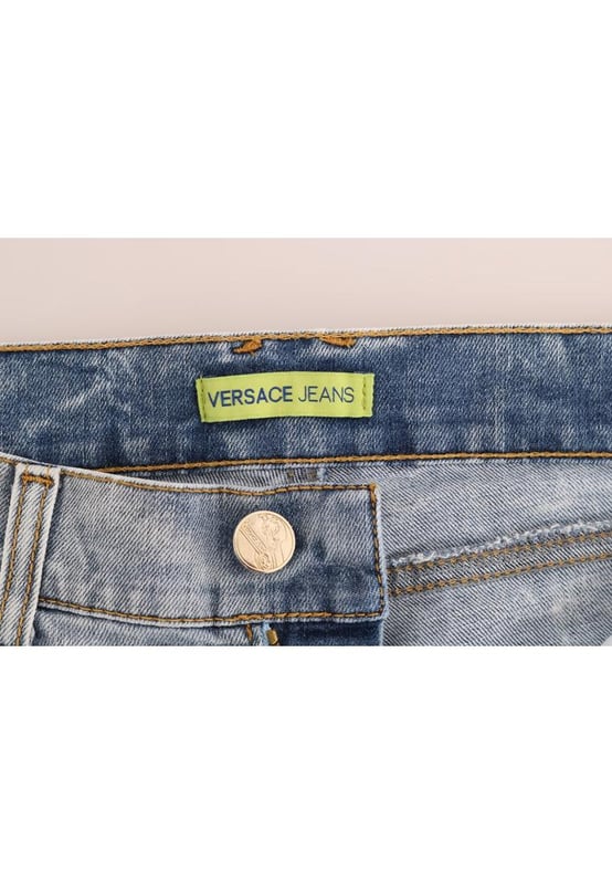 Absolutely stunning 100% Authentic brand new with tags
  Blue wash and torn cotton stretch jeans
  Mid waist slim fit
  Light blue wash
  Torn detailing
  Two front and two back pockets
  Logo on the back right pocket
  Zipper fly closure
  Made in Italy
  Material: 98% Cotton 2% Elastane (stretch)
