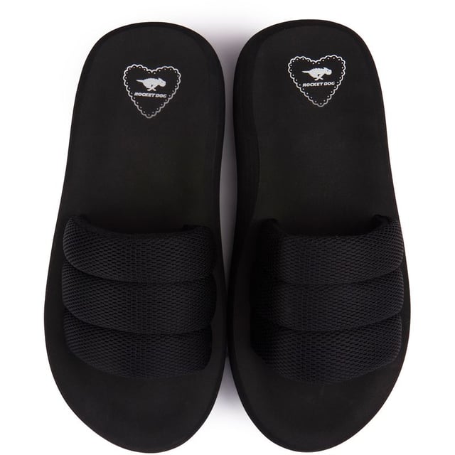 Sandalias Rocket Dog Splash de mujer en color negro, confeccionadas en textil y suela de goma. Incluye: plantilla acolchada, parte superior textil, marca Rocket Dog, suela ligera y gruesa.