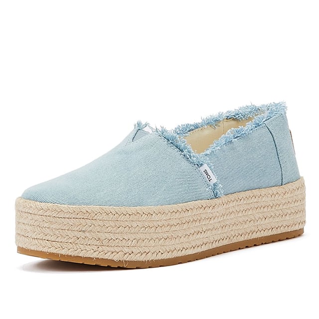 Elevate your style with these trendy espadrille platform slip-ons, featuring stylish textile uppers. The rope wrap platform adds a touch of sophistication to these shoes. Enjoy superior comfort with the padded heel that cushions your feet with every step. The OrthoLite Eco LT Hybrid insoles are made with 26% eco content, including 15% waste foam, 5% recycled materials, and 6% bio-oils, ensuring both comfort and sustainability. The rubber outsole offers excellent grip and durability. With an outsole height of approximately 1.5 inches, these slip-ons provide the perfect amount of elevation. Rest assured, these shoes are completely vegan, catering to your ethical choices. Step out in style and comfort with our exceptional espadrille platform slip-ons.