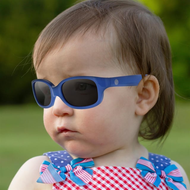 Smarty Rectangle Kids Blue Grey X2055  Sunglasses Shield your baby's eyes in style with SMARTY Designer Sunglasses model X2055E, perfect for infants to 3-year-olds. These rectangular-shaped sunglasses feature a cheerful blue frame with durable plastic arms and grey lenses, providing superior UV protection and a fun, trendy look. The X2055E model combines modern design with baby-friendly comfort and durability, ensuring your little one stays safe and stylish during sunny adventures. Available at an unbeatable discount from the regular retail price, these designer sunglasses offer exceptional quality and value. Give your baby the perfect blend of protection and style with SMARTY sunglasses.