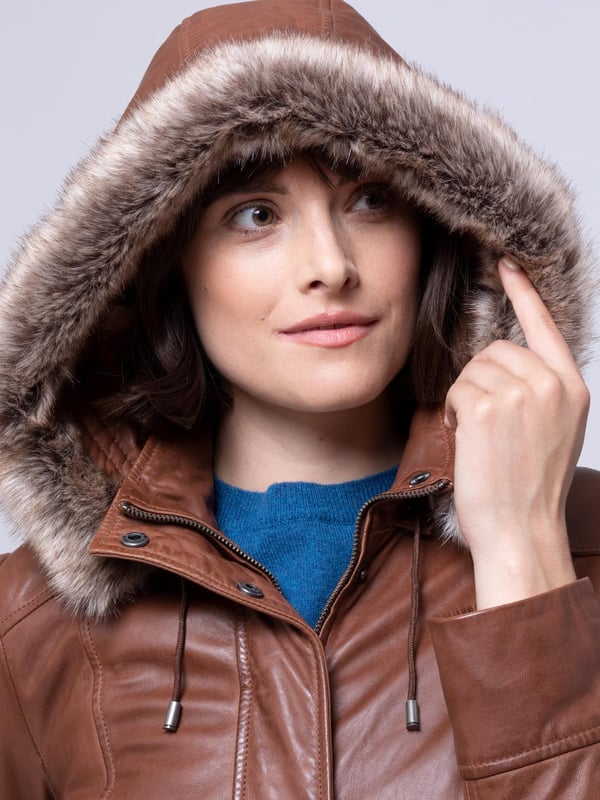 Ravensworth Long Leather Coat in Tan Make no mistake. The cold is coming. And there is no better protection against the elements than the Ravensworth long leather coat in a striking tan colourway. Not only designed to keep the cold at bay, we've crafted a flattering coat, with a long contoured panels to accentuate your figure.
Well-judged details include a detachable faux-fur trimmed hood, popper placket concealing a zip fastening, longline design, and a funnel collar. Stay warm this season and beyond.
We almost forgot to mention the sumptuously soft UK sourced aniline leather, with antique effect over-dye. It's easy to see why the Ravensworth is our new any-occasion hero.
Sizing
These measurements are based on a size 12 and will vary slightly between sizes.
Approximate centre back length: 84cm
Approximate sleeve length from shoulder to cuff: 63 cm
Approximate sleeve length from underarm to cuff: 44cm
The Details
Exclusive to Lakeland
Style Name: Ravensworth Long Leather Coat
Colour: Tan
Material: Aniline Leather
Fit: Easy Fit
Two zip pockets
Concealed zip front fastening
Faux fur trim
Removable hood
Funnel collar with toggle detail
And on the inside
Tonal satin lining
