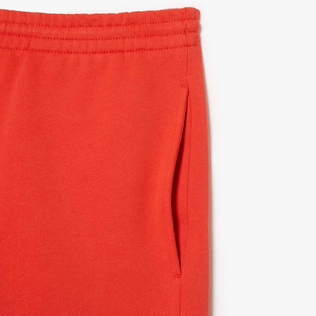 Men's Lacoste Organic Brushed Cotton Fleece Shorts Regular fit  straight cut: Unrestricted movement. Drawstring at waist: An adjustable waistband for optimal comfort. Piped back pocket: Practical and functional. Embroidered crocodile sewn onto front: Lacoste signature performance. Brushed organic cotton fleece: Long-lasting comfort during practice.