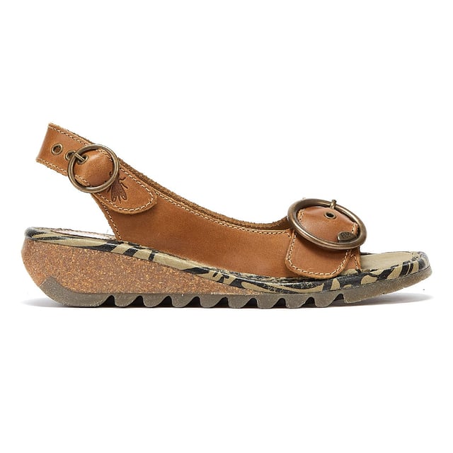 These slingback leather sandals by Fly London offer excellent comfort and easy on/off. The quality rubber outsole boasts a distinctive tread and is combined with a 3.5cm wedge midsole for gentle lift. Complete with bronze buckles for a bespoke fit.