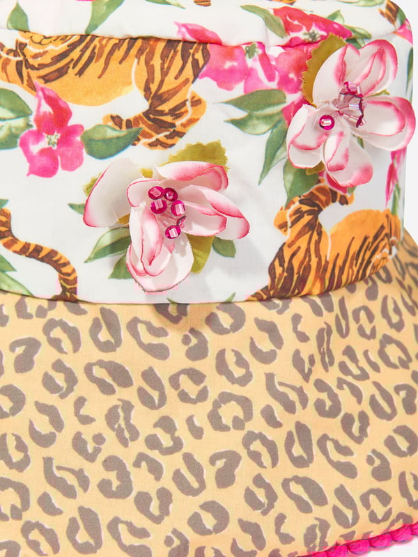 Welcome the Girls Floral Tiger Bucket Hat in Multicolour by Selini_Action, a unique accessory to elevate your Girl's spring/summer 2024 looks.Key highlights include: Vibrant Design: It features a bold, multicoloured tiger and floral prints guaranteeing to make your child the star of every event. Comfort and Style: Crafted from premium quality materials, this bucket hat is not only eye-catching but also provides utmost comfort, making it perfect for daily wear.    Must-Have Accessory: This multicoloured bucket hat isn't just a fashion piece, but a vital addition to your girl's wardrobe! Don't wait, purchase now and let her flaunt her stylish side!