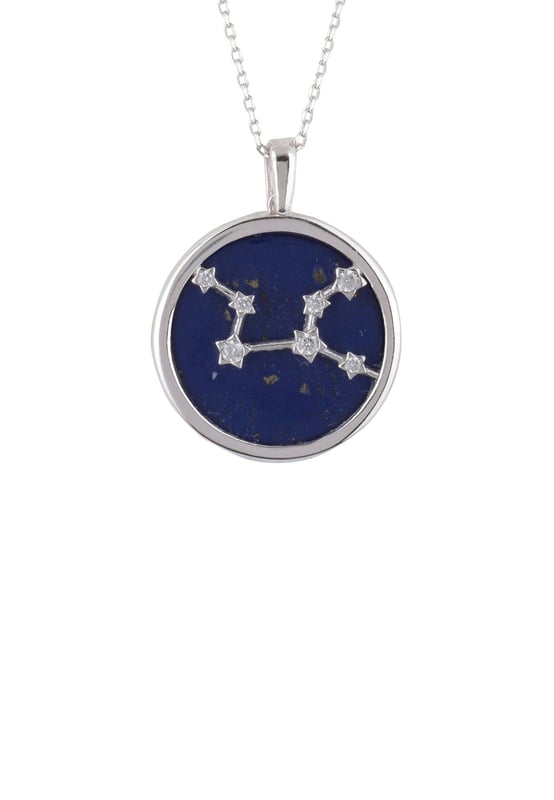Look no further than this beautiful Zodiac Lapis Lazuli Gemstone Star Constellation Pendant Necklace to make a dazzling statement! This gorgeous necklace is crafted in the finest 925 sterling silver, encasing a disc of Lapis Lazuli and handset with shimmering white cubic zirconia. It features a stunning star constellation on its face, which pairs perfectly with the deep blue hue of lapis lazuli for an eye-catching effect. Plus, to make it even more special, it includes an engraved name of your star sign on the reverse along with cut-out stars.Virgos, born between August 23 and September 22, are known for their analytical minds, practicality and attention to detail. They are often perfectionists who strive for the highest standards of excellence in all areas of life. Virgos have an eye for seeing the big picture and also understanding how small details fit into it.It's perfect for every fashionista who loves delicate jewellery that stands out from the crowd. Enjoy the versatility of being able to wear this pendant at a length to suit you due to its 40cm plus 5cm (with adjuster) length. Meanwhile, its lightweight design at just 5.3 grams ensures you won't be weighed down when wearing it all day long.We think you'll be absolutely delighted with this Zodiac Lapis Lazuli Gemstone Star Constellation Pendant Necklace Silver! With its distinctly fashionable yet timeless design and quality craftsmanship.