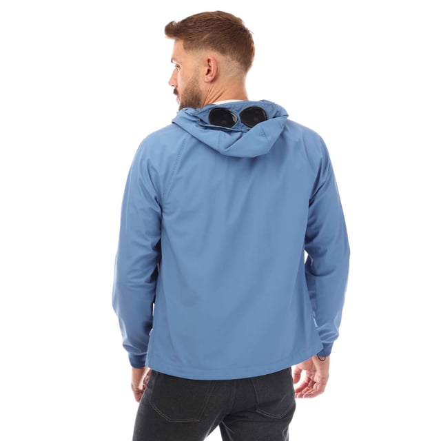 Mens C.P. Company Google Jacket in light blue.- Adjustable Goggle hood.- Two-way full zip fastening.- Side pockets.- Adjustable hem. - Ribbed cuffs.- Windproof anti-drop treated.- Regular fit.- 94% Polyamide  6% Elastane.- Ref: 15CMOW031A818