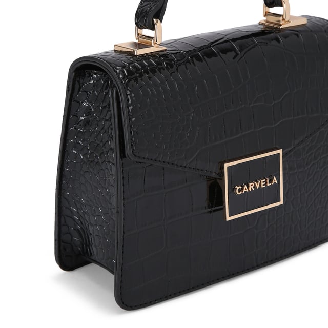 This Jessica Top Handle Bag features a black exterior with large croc print. There is a gold branded plate on the front flap.15cm (H), 17cm (L), 7cm (D). Strap length: 125cm. Gold tone chain strap with two inserts.