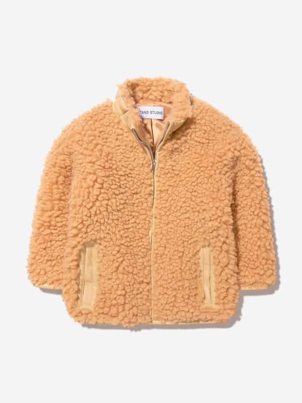 This sweet faux fur mini jacket from Stand Studio is perfect for little girls. Crafted from 100% polyester, it features a beige color and luxuriously soft fur. The cute design includes a snap front closure and side pockets for ultimate comfort and style. Perfect for a casual outing, it will keep little ones warm and looking cool.·  Stand Studio·  Occasion: Casual·  Plain