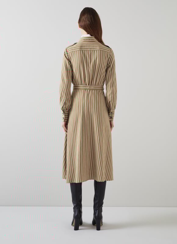 The shirt dress is an LKB sigture, and our new Frances dress takes on a utilitarian twist with feminine flair - and flare. Crafted in Europe from a sustaible viscose rich fabric in tan with green and white stripes, it's a classic collared, button-through style with horn-effect buttons, epaulettes to the shoulders, long sleeves with elegant cuffs, a bucked belt and a midi-length flared skirt. Wear it over a polo neck and long boots now, and shed the layers once the weather warms up.