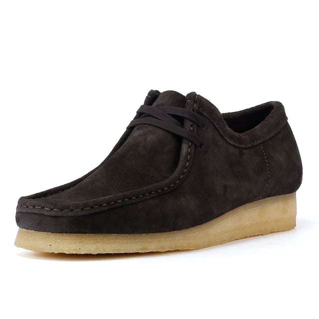 The iconic Clarks Wallabee shoe in boot style. The moccasin-inspired, structured silhouette offers clean and simple lines. Crafted from suede, the Wallabee boots features a lace up fastening and distinctive crepe sole.
