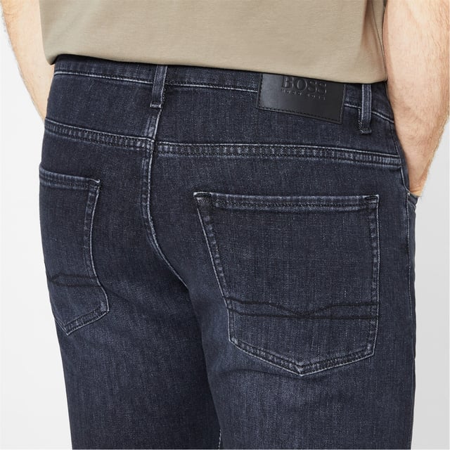 Hugo Boss Slim Delaware Jeans - Upgrade your wardrobe and transform your weekend collection with these Hugo Boss Slim Delaware Jeans. Cut to a slim fit, this pair of raw jeans feature a zip fly button fastening and belt loops for a secure and comfortable fit. Finished with the classic five-pocket styling and a brand tag at the back, you can pair them with a bomber jacket and Chelsea boots for a modern biker inspired look. - >Men's Jeans - >Tapered Fit - >Zip Fly - >Button Fastening - >Belt Loops - >5 Pockets - >Raw Denim - >Brand Badge on the Back - >Hugo Boss Branding - >60% Cotton, 40% Polyester - >Machine Washable - >Keep Away From Fire