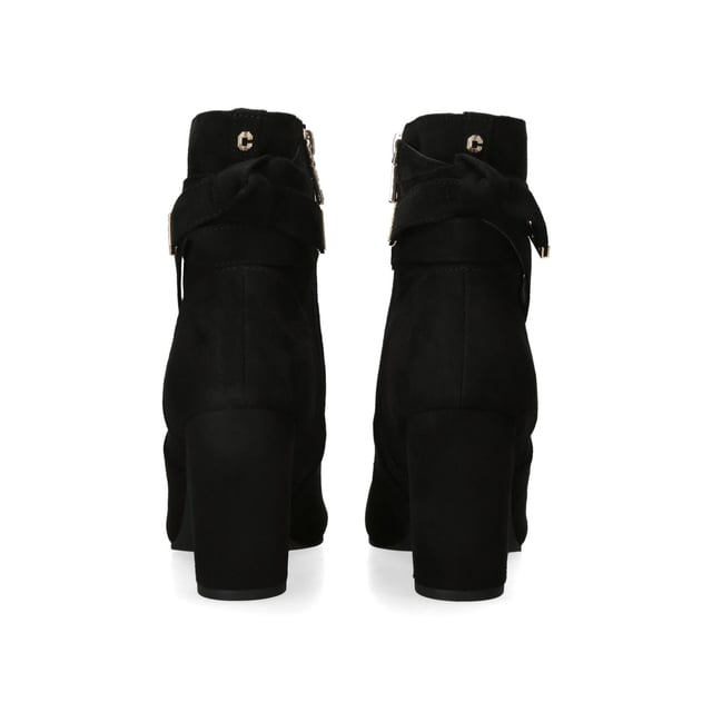 The Carvela Tempt ankle boot features a black microsuede upper. There is a bow detail at the back of the ankle with gold tone branding. The inner side of the ankle features a zip for comfort. Heel height: 90mm.