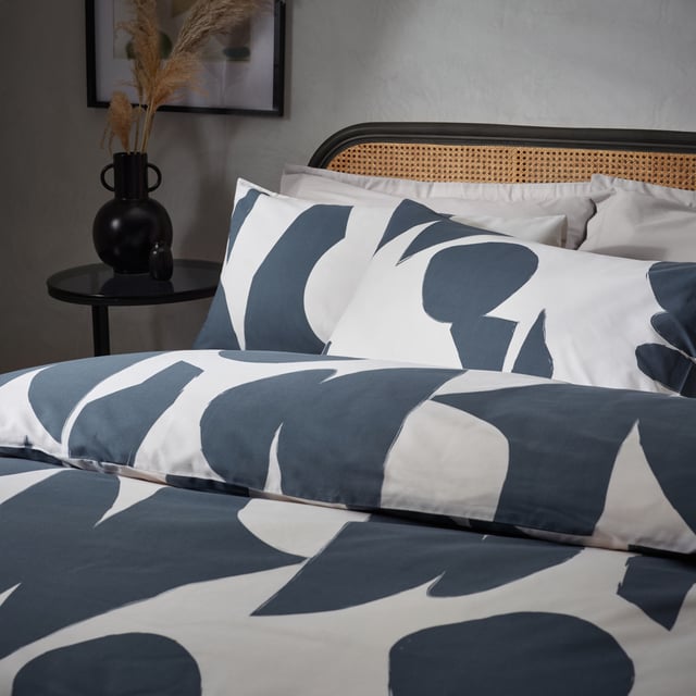 Enjoy a restful night’s sleep in the timeless Meta duvet cover set. Inspired by modern, minimalist and abstract art, it features fluid marks and angular shapes, fused together on a warm, relaxing neutral background. The reverse is identical to the front and is printed onto soft, cotton rich fabric for a comfortable night’s rest. Choose between the dusk colourway, which is a modern alternative to monochrome, or the multi-coloured design which adds a pop of colour to neutral, modern and stylish surroundings. This product is certified by OEKO-TEX® showing it has been sustainably made.