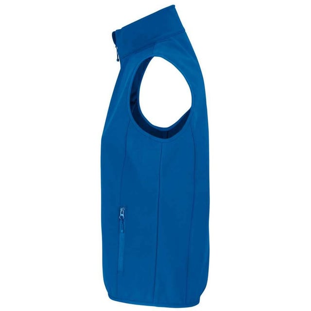 Outer Materials: 94% Recycled Polyester, 6% Elastane. Lining: Fleece, Polyester. Fabric: Softshell. Design: Plain. Fabric Technology: Breathable, Waterproof, Windproof. Bound Armholes, Chin Guard, Elasticated Arm Holes, Inner Zip Guard, Tearaway Label, Three Layers. Sleeve-Type: Sleeveless. Neckline: Standing Collar. Pockets: 1 Chest Pocket, 2 Lower Pockets, Zip. Fastening: Full Zip. Hem: Bound, Elasticated. Sustainability: Amfori, BSCI, Fair Wear Approved, GRS Certified, Oeko-Tex Standard 100 Certified, PETA-Approved Vegan, REACH.