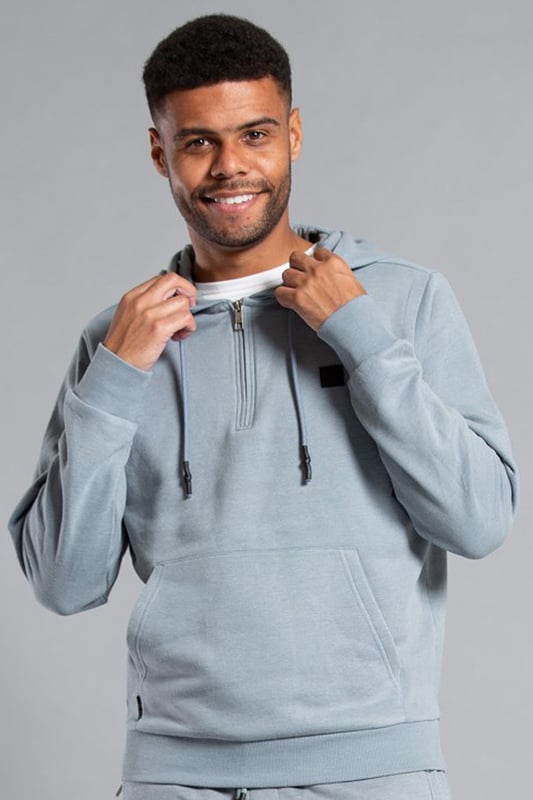 Grey Cotton Blend Hoody With Neck Zip Fastening Upgrade your essentials in this Tokyo Laundry hoody with quarter zip fastening. Features quarter zip fastening at neck, drawstring, kangaroo pocket, ribbed elasticated cuffs and waistband, and Tokyo Laundry raised rubber badge on the chest. The hoody is lined inside with brushed-back fleece and is made from cotton blend fabric to ensure comfort and quality.