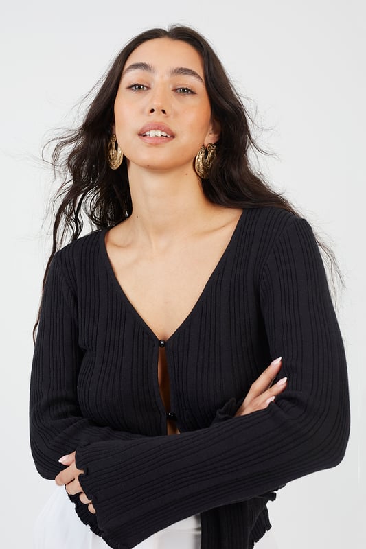 Enhance your style with this open-front ribbed cardigan from Brave Soul. Crafted from 100% cotton and features an open front with two button fastening, wide sleeves, and lettuce cuffs. Team with a pair of wide-leg trousers for an elevated stylish look. Model wears UK size S.