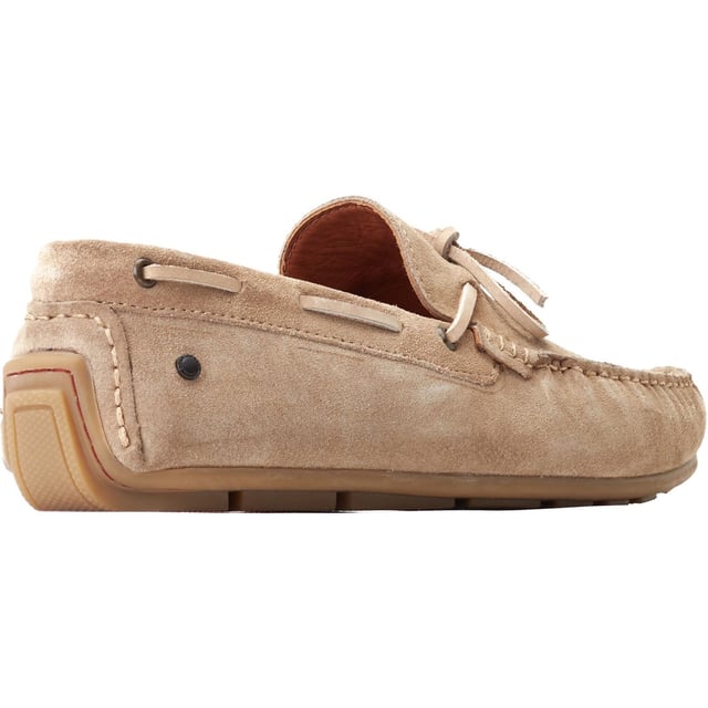Base London Brooks Leather Men's Sand Loafers The Drum loafer from Base London is your casual summer staple. The soft suede uppers and Ortholite insole provide a comfy ride while the detailing on the nylon strap across the vamp elevates this style and gives it character.