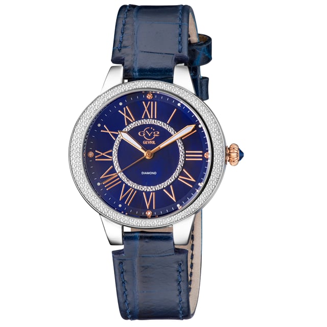 Named after Manhattan’s famed Astor Place, known for its culture and creativity, the Astor II collection elevates drama to high art.
With the Astor’s signature 38mm diamond-cut bezel and distinctive blue cabochon gemstone crown, the Astor II is not to be outdone boasting a show-stopping mother of pearl face. In brilliant black, blue or white mother of pearl, the distinguished Astor II ups the ante with four single cut diamonds encircling a diamond-cut inner circle. In Brown, Blue, Grey, Red or White Italian Leather Strap, elegance has a new name.
Heighten drama and elevate intrigue with the stunning Astor II collection: easy to appreciate and hard to ignore.
GV2 9149-L5 WoMens Astor II Swiss Diamond Watch

GV2 WoMens Swiss Watch from the Astor II Collection
38mm 316L Stainless Steel Case, Diamond Cut Bezel
Brilliant Blue MOP Dial with Rose Gold Indices, 4 Single Cut Diamonds on Dial, with diamond-cut inner circle
Push Pull Fluted crown with Blue cabochon Stone
Genuine Handmade Blue Italian Leather Strap with Tang Buckle
Anti-reflective Sapphire Crystal
Water Resistant to 30 Meters/3ATM
Swiss Quartz Movement Ronda 1069.