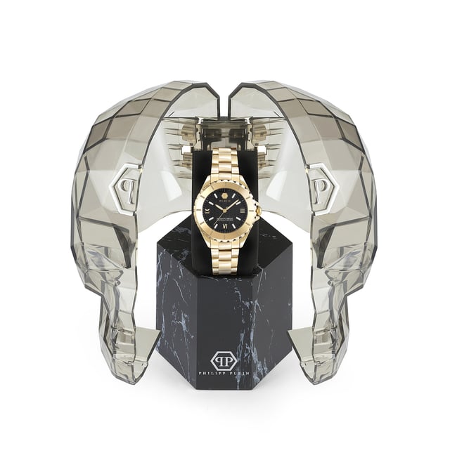 This Philipp Plein Plein Heaven Analogue Watch for Women is the perfect timepiece to wear or to gift. It's Gold 38 mm Round case combined with the comfortable Gold Stainless steel watch band will ensure you enjoy this stunning timepiece without any compromise. Operated by a high quality Quartz movement and water resistant to 5 bars, your watch will keep ticking. Philipp Plein’s Heaven watches represent the epitome of sophistication and technical mastery within the world of luxury timepieces. This Analogue watch has a  function: Luminous Hands High quality 19 cm length and 18 mm width Gold Stainless steel strap with a Deployment clasp Case diameter: 38 mm,case thickness: 12 mm, case colour: Gold and dial colour: Black