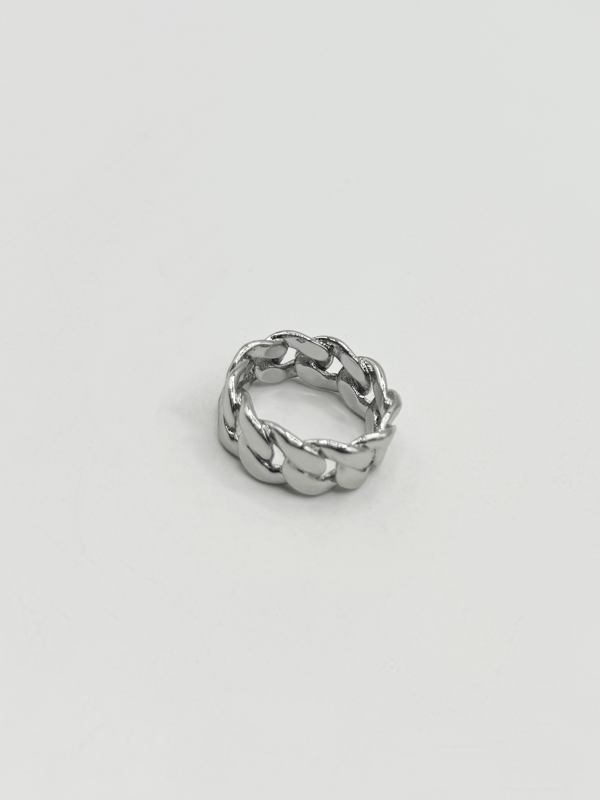 The ring's polished finish enhances its sophisticated appeal, making it a versatile accessory suitable for any occasion. Whether worn as a statement piece or a subtle nod to one's heritage, this Cuban silver ring embodies timeless style and cultural pride.  Ring Size 9. Stainless Steel.