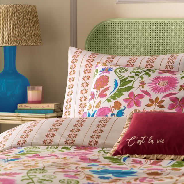 Inspired by the gardens of India, the Curious Lotus duvet cover set is filled with intriguing exotic florals and fauna. Bright pinks, cobalt blues, and warm pecans intertwine to create an eye-catching print. Complete with an intricate striped reverse, providing you with two distinct looks for a midweek refresh.