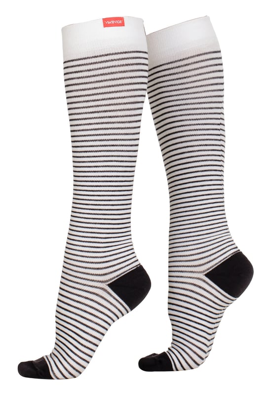 Energize your legs! Using integrally-knit graduated compression, these compression socks apply therapeutic pressure that starts at the ankle and gradually eases above. It’s this external pressure that energizes your legs and Reduces Swelling. These socks have a 30-40 mmHg compression level that is ideal for all-day, everyday wear, sitting or standing for long periods. High-quality premium cotton fibers and Spandex throughout the sock allow for sustained compression throughout the day. Alleviate achiness & heaviness by squeezing the legs from the bottom up, our legwear can help increase circulation of freshly oxygenated blood back to your legs. These are made for people with circulation problems and also ideal for flight travel, pregnancy, exercising, when sitting or standing for long periods of time and even during visits to hospital. These socks are specially designed to energise legs, reduce swelling, alleviate achiness & heaviness and to aid in muscular recovery. The specially designed fabric cotton blends and The 200-needle count gives supreme comfort and flexibility which contours leg and heel for superior fit. These socks are comfortable and breathable with graduated compression from ankle to calf with a contoured leg and heel for a great fit. The flexible toe pocket doesn’t squeeze the toes! They are also the extra wide style to fit comfortably around the wider legs and calves. Tested & Trusted: Based out of Missoula, Montana, VIM & VIGR is dedicated to creating products that provide you with everyday relief. VIM & VIGR graduated compression legwear was developed in partnership with vascular surgeons and vein clinics and all products are listed with the Food and Drug Administration (FDA). These compression socks are available in 4 colours and 3 sizes: Small/Medium, Medium/Large and Large/X-Large. They’re made out of 48% Cotton, 42% Nylon, 10% Spandex (Latex-free).