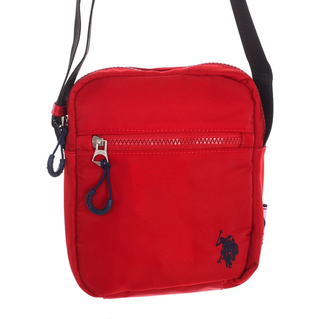 Men's shoulder bag from the U.S. POLO ASSN brand.
 Synthetic material exterior.
 Top zipper closure.
 Zipper pocket on the front and back.
 Back interior: One zipper pocket.
 Adjustable strap with brand print.
 Brand logo on the front.
 Seams seen in tone.
 Measures: 17x20x5.5cm
 Composition: 100% Nylon
 Care:
Clean with a wet cloth.