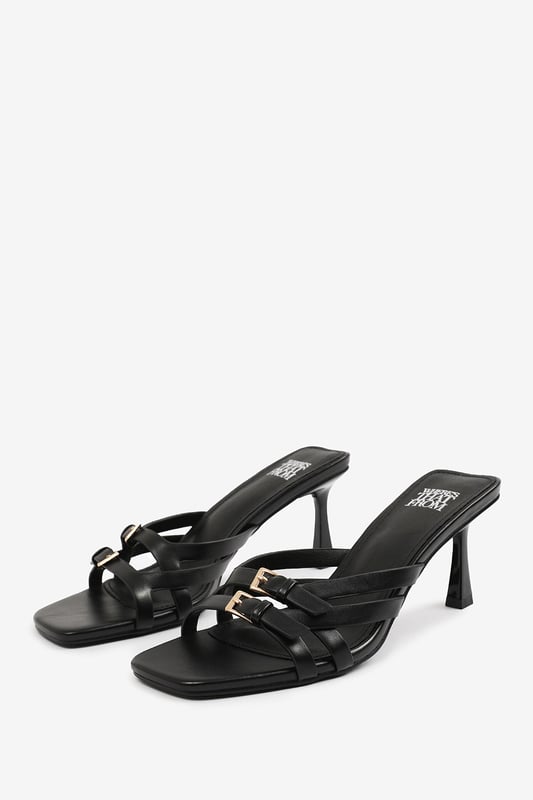 Step up your style with these Torigh Cross Over Buckle Details Strap Heel. Perfect for casual outings or dressy events, these sandals combine modern elegance with lasting comfort, making them a must-have addition to your wardrobe.

Key Features: 
Durable Construction: Crafted with high-quality faux leather, these sandals are designed to last. The sturdy heel and durable straps provide reliable support, ensuring they can withstand regular wear without compromising style.
Chic Design: The multi-strap design with subtle metallic accents exudes elegance and sophistication. The square toe and slender heel add a modern, fashion-forward touch that enhances their timeless appeal.
Comfortable Fit: Featuring a padded insole and a balanced heel height, these sandals provide all-day comfort without sacrificing style. The open design ensures breathability and ease of wear, making them perfect for any occasion.

Specifications:
o   Material: High-quality faux leather
o   Heel Type: Slender heel
o   Closure: Slip-on design for convenience

Elevate your footwear collection with these Torigh Cross Over Buckle Details Strap Heel. Combining chic design, durable construction, and superior comfort, they are perfect for making a statement wherever you go!