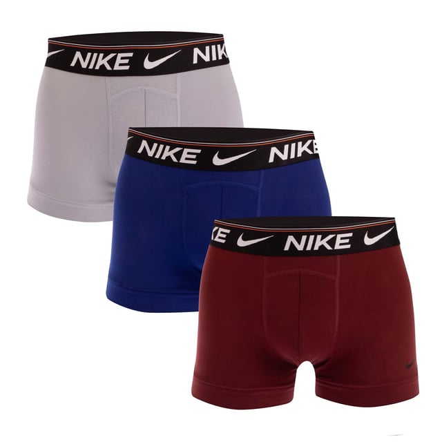 Men's Nike Dri-FIT Ultra Comfort 3 Pack Boxer Trunks in Multi colour Mens Nike Dri-FIT Ultra Comfort 3 Pack Boxer Trunks in Wolf Grey - Dark Team Red - Deep Royal Blue.- Comprises one pair x Wolf Grey one pair x Dark Team Red one pair x Deep Royal Blue boxer trunks.- Nike Dri-FIT technology helps you stay dry and comfortable.- Ultra-soft fabric with added stretch for an incredibly comfortable fit.- Specially constructed pouch for enhanced support.- Nike branding at waistband and left leg.- 94% Reprocessed polyester 6% Elastane. Machine washable.- Ref: 0000KE1256065We regret that underwear is non-returnable due to hygiene reasons.
