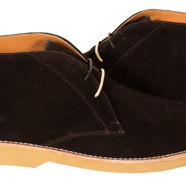 Booted shoe.
 Made of leather with a suede finish.
 Lace closure on the front.
 Leather insole customized by the brand.
 Flap with the brand name.
 Rubber sole.
 Cream stitching.
 Composition: Exterior: Leather; Interior: Leather,
 Care:
- Clean with a cloth dampened with water.