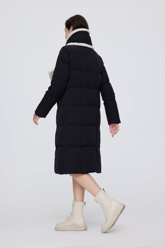 Crafted with premium 680+ quality duck down, this jacket blends elegance with sustainability. Made from eco-friendly, biodegradable fabric—an award-winning choice in sustainable fashion—it features a soft, minimalist hooded design and a detachable scarf for added versatility and warmth.

HIGH QUALITY 680+ DUCK DOWN: 90% filling for optimal warmth, evenly distributed for consistent warmth.

ECO-FRIENDLY TECH FABRIC: Made from eco-friendly SORONA fabric, derived from plants and biodegradable.