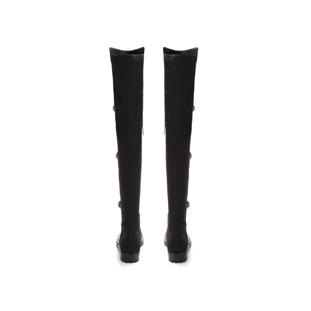 The Kurt Geiger Shoreditch boot features a grained leather upper which sits above the knee. The outer side of each boot features four antiqued brass eagle heads with crystals.