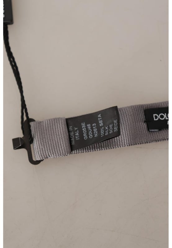 Stunning Dolce & Gabbana gray silk bow tie
  Made with 100% silk
  Timeless gray color
  Adjustable length neck strap
  One size fits all
  Expertly crafted in Italy
  Width: 7cm
  Versatile accessory for formal and special occasions
Material: 100% Silk
