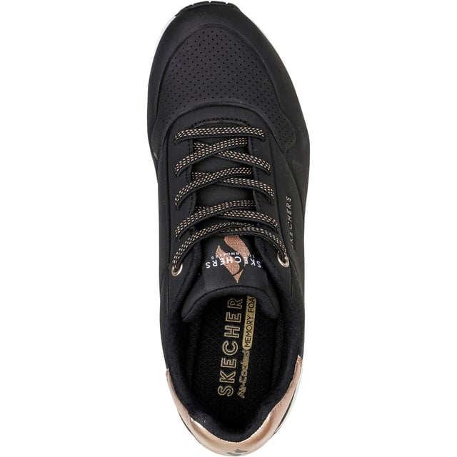 Slip-on a classic style in comfort wearing Skechers Street Uno - Shimmer Away. This fashion sneaker features a synthetic durabuck upper with a metallic trim, stretch laces, Skechers Air-Cooled Memory Foam insole and Skech-Air visible airbag midsole.