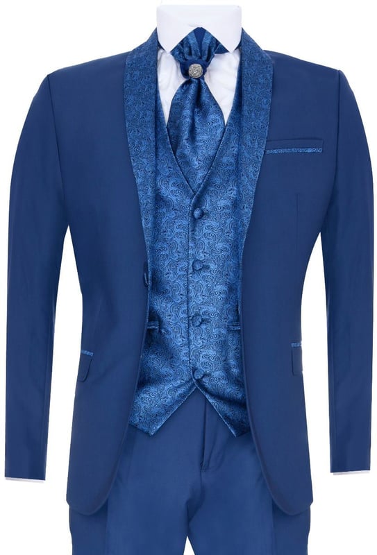 Sharp, sleek and sophisticated, look the part with this premium 4 piece Blue Suit, that features a Tailored Fit (inbetween Slim & Regular) with a closer fit across the chest and narrower tailored trousers. The jacket hangs beautifully and has a half canvas construction that moulds to your body shape the more you wear it. Contrasting flap pockets, buttoned cuffs and a single back vent lend the suit a classic touch of refinement. The suit features a Shawl Round Collar Design Blazer with a Unique Satin Paisley Contrast made from Soft Textured Fabric A paisley waistcoat completes the 4-piece with a 4-button down style with classic tailored pockets and a back adjuster to ensure you can create your ideal fit. The suit is evergreen and contemporary at the same time and allowing you to look the best all day. Pair it with a white shirt and shoes for a dapper finish.