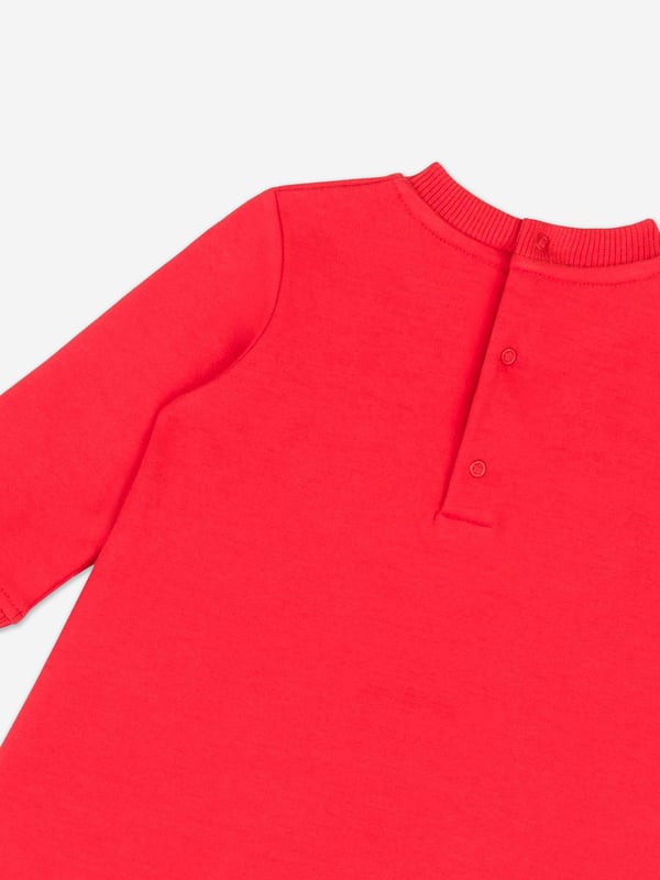 Italian fashion House Moschino depict energy and precision into their fun-filled abstracts. This baby girls poppy red sweater dress is reflective of the label's passion for the teddy bear motif and its reconceptualised forms. It showcases an adorable beady-eyed teddy bear with gifts via delicate embroidery in high quality cotton.‚ Crew Neck‚ Long Sleeves‚ Back Button Closure‚ 95% Cotton, 5% Elastane