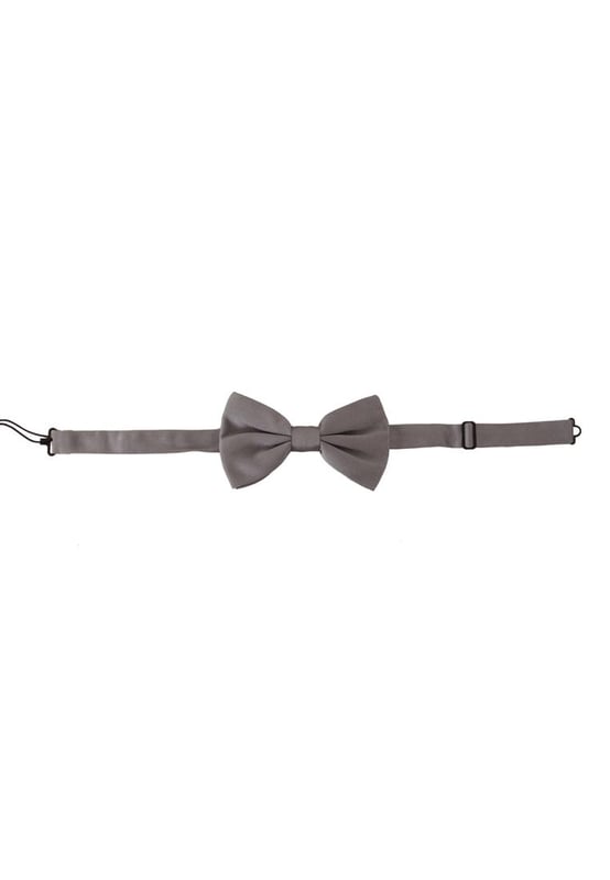 Stunning Dolce & Gabbana gray silk bow tie
  Made with 100% silk
  Timeless gray color
  Adjustable length neck strap
  One size fits all
  Expertly crafted in Italy
  Width: 7cm
  Versatile accessory for formal and special occasions
Material: 100% Silk