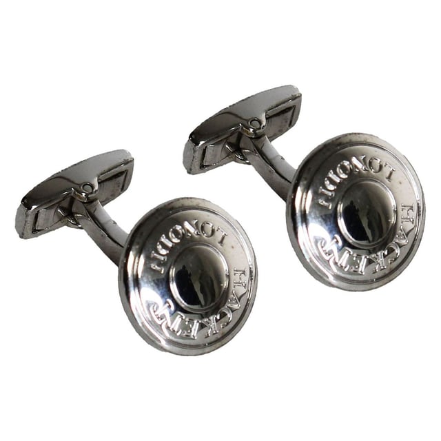 Hackett London Polo Button Men's Grey Cufflinks – a distinctive and sporty accessory that combines classic elegance with a touch of athletic flair. These cufflinks are a testament to Hackett London's commitment to quality craftsmanship and attention to detail. Here are the key features of these unique cufflinks:

 Premium Quality:  Crafted with precision and care, these cufflinks are made from high-quality materials, ensuring durability and a polished appearance. Hackett London is renowned for its dedication to quality craftsmanship.

 Polo Button Design:  These cufflinks feature a sporty and iconic polo button design, paying homage to the sport of polo, which is closely associated with the Hackett brand. The button design adds a touch of athleticism and character to your attire.

 Grey Color:  The grey color of the cufflinks is versatile and understated, making them suitable for a wide range of dress shirts and suits. Grey exudes sophistication and complements various outfit choices.

 Easy Application:  The cufflinks come with a simple and secure fastening mechanism, allowing you to easily attach and remove them from your shirt cuffs. They are designed for convenience and ease of use.

 Versatile Styling:  These cufflinks are versatile and can be worn for a variety of occasions. Whether you're attending a casual event, a business meeting, or simply want to add a touch of personality to your outfit, these cufflinks make a unique statement.

 Durable Construction:  Hackett London's commitment to quality ensures that these cufflinks are built to last. They are designed to withstand regular use without losing their shine or charm.

 Iconic Hackett London Branding:  The cufflinks may feature discreet branding, such as the Hackett London logo or name, adding an element of exclusivity and authenticity to your attire.