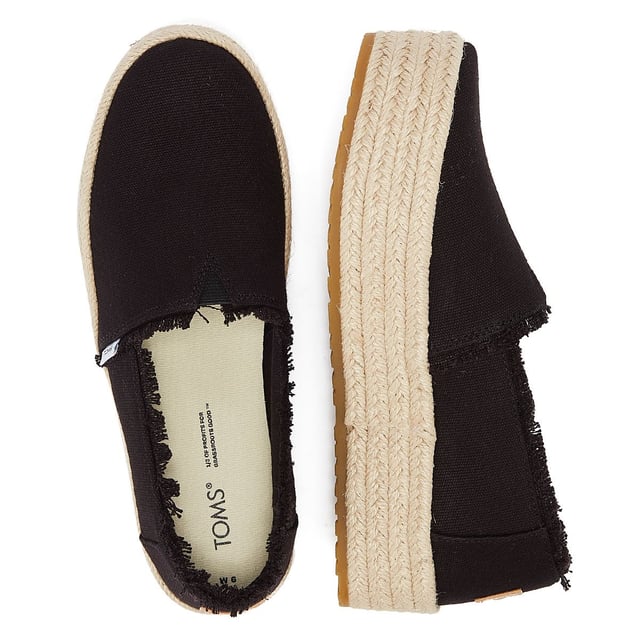 Elevate your style with these trendy espadrille platform slip-ons, featuring stylish textile uppers. The rope wrap platform adds a touch of sophistication to these shoes. Enjoy superior comfort with the padded heel that cushions your feet with every step. The OrthoLite Eco LT Hybrid insoles are made with 26% eco content, including 15% waste foam, 5% recycled materials, and 6% bio-oils, ensuring both comfort and sustainability. The rubber outsole offers excellent grip and durability. With an outsole height of approximately 1.5 inches, these slip-ons provide the perfect amount of elevation. Rest assured, these shoes are completely vegan, catering to your ethical choices. Step out in style and comfort with our exceptional espadrille platform slip-ons.