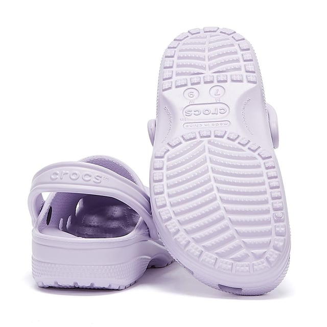Womens Crocs Classic Clogs in lavender.- Slip on fastening.- Pivoting heel straps.- Ventilation ports add breathability and help water and debris drain away.- Croslite™ footbed.- Lightweight  non-marking soles.- Ref: 10001530L