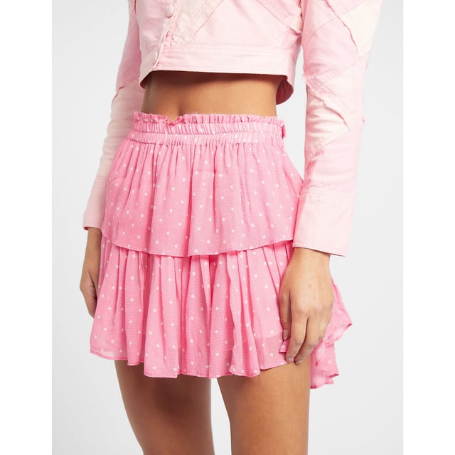 LoveShackFancy encapsulates feminine  romantic and vintage inspired designs with their use of fine lace detailing  elegant prints and soft hues. Founded in 2013  the brand has gained global appeal for its flattering silhouettes  hand dyed fabrics and designs  inspired by founder Rebecca Hassel Cohen's immersive travels. These elements are shown perfectly in this Ruffle Mini Skirt which comes in a pink colourway and tiered design  the perfect addition to your Summer wardrobe. Details: pink colourway  cotton construction  elasticated waistband  tiered design  drop hem  mini length  regular fit and finished with a polka dot design. Cold wash only.