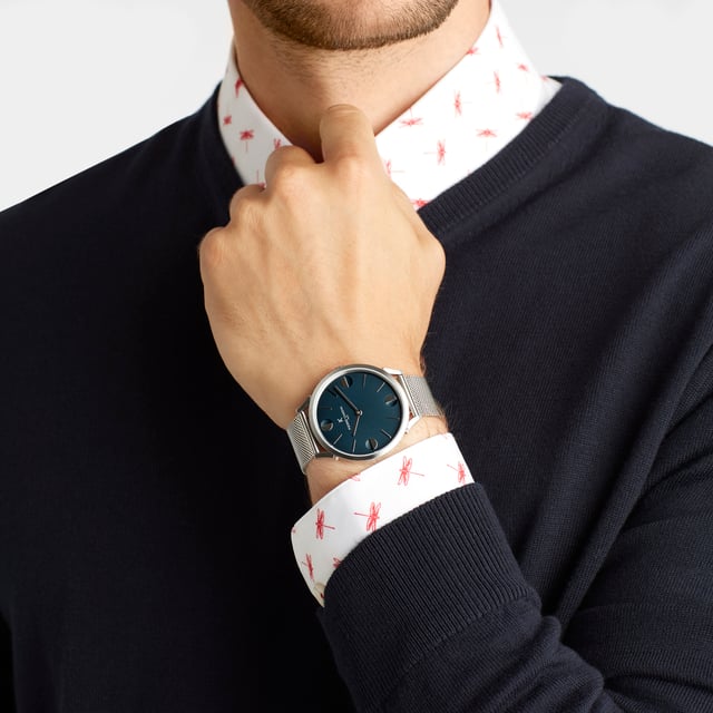 This Pierre Cardin Pigalle Half Moon Analogue Watch for Unisex is the perfect timepiece to wear or to gift. It's Silver 40 mm Round case combined with the comfortable Silver Stainless steel watch band will ensure you enjoy this stunning timepiece without any compromise. Operated by a high quality Quartz movement and water resistant to 3 bars, your watch will keep ticking. This fashionable and classic watch matches any outfit at any occasion,it adds style to your life High quality 21 cm length and  18 mm width Silver Stainless steel strap with a Fold over clasp Case diameter: 40 mm,case thickness: 6.55 mm, case colour: Silver and dial colour: Blue