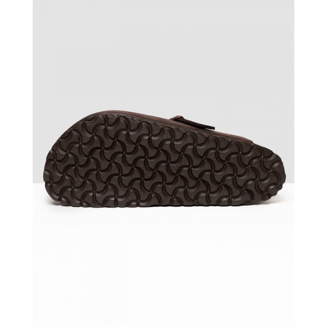 Men's Birkenstock Boston Leather Sandals in Brown Dating back to 1774 and originating from Germany BIRKENSTOCK is globally known for their signature footwear styles influenced by two and a half centuries of brand history. Providing comfort and durability they present these mens Boston Leather Slip On Shoes featuring their signature Birko-Flo skin-friendly material. Details: brown colourway adjustable buckle strap round toe cork footbed leather upper tonal stitching and embossed branding to side to complete.