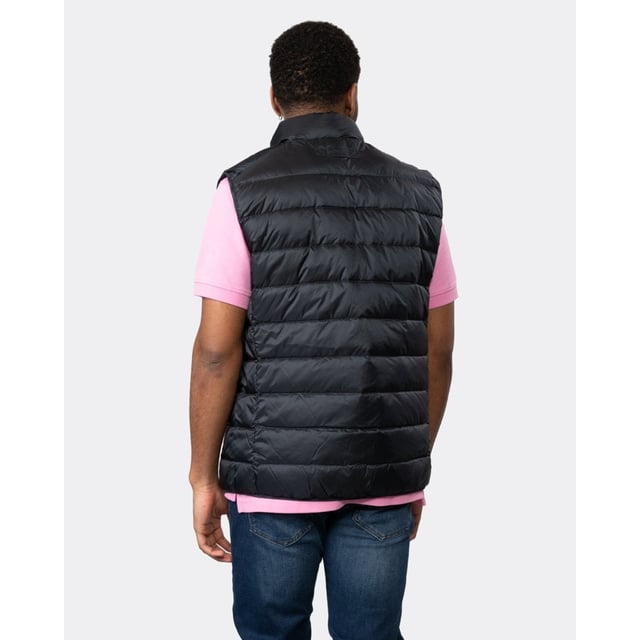 Crafted in a lightweight recycled polyester with a water-repellent finish, this Light Down Vest adds a perfect layer of warmth when the temperatures suddenly drop. With a length that falls slightly above the hips, interior zip and patch pockets and its straight channel quilting, this vest is a must-have for cooler mornings or evenings out after sundown.
Regular fit  Printed logo at chest  Water-repellent  Fully lined
Shell - Recycled Polyester 100%, Lining - Recycled Polyester 100%, Padding - Down 90%, Feathers 10%
7006299