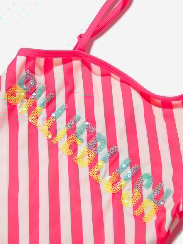 Introducing the elegant Girls Swimsuit with 2 Scruchies in Pink by Billieblush - the ideal holiday ensemble for your little fashionista.  Fashion-forward Design: Boasting a stylish, vibrant pink colour sure to turn heads at the pool or beach. High-Quality Fabric: Crafted with premium material, ensuring softness and comfort for your child's delicate skin. Unique Extras: Comes with matching scrunchies, perfect for creating cute and coordinated hairstyles. Renowned Brand: Brought to you by Billieblush, a symbol of premium children's fashion.This splendid swimsuit is a wardrobe must-have to make your little one shine in style this holiday season. Order now.