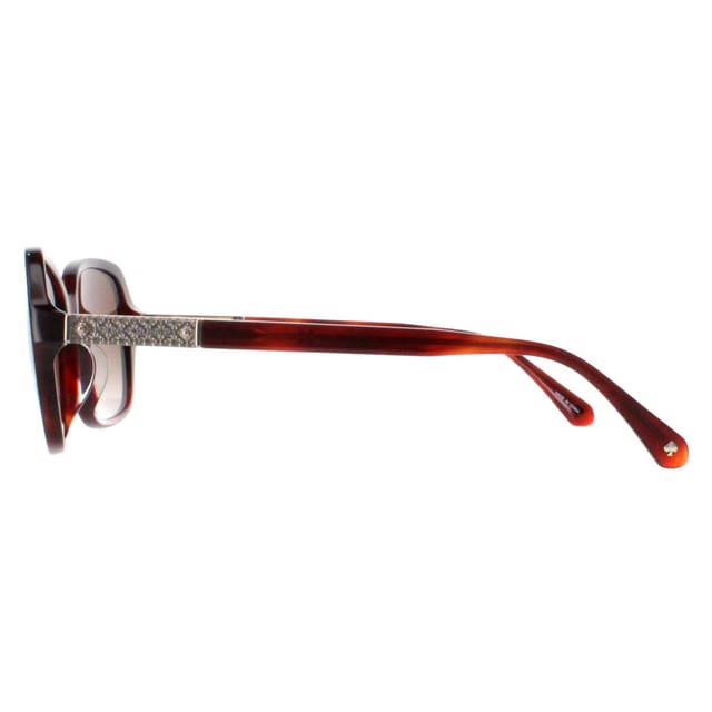 Kate Spade Buttefly Womens Havana Brown Gradient Polarized Yvette/S S Sunglasses heeft een chique vlindermontuur van hoogwaardig acetaat, dat zowel duurzaamheid als lichtgewicht comfort biedt. De lenzen bieden uitstekende UV-bescherming, zodat je ogen beschermd zijn tegen schadelijke zonnestralen terwijl je helder zicht behoudt. De poten zijn versierd met het iconische Kate Spade-logo, voor een vleugje luxe en verfijning.